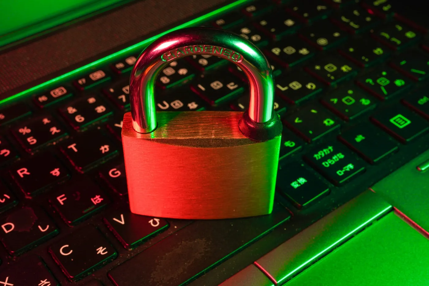 A padlock resting on a laptop keyboard.